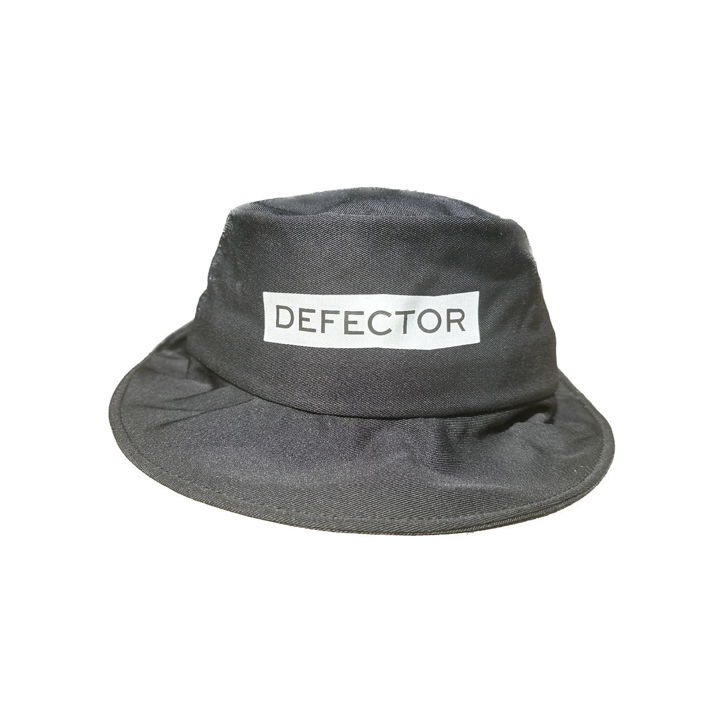 All black bucket hat with Defector logo in white on the center of it, printed.