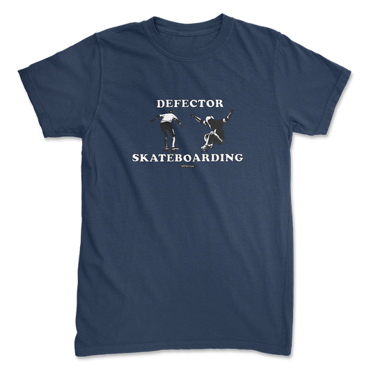 Defector shirt that says “DEFECTOR SKATEBOARDING.” Features clip art of skateboarding.  Navy shirt in ‘unisex’ cut.