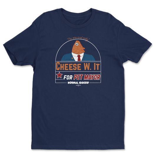 A campaign slogan for CHEESE W. IT for PET MAYOR with a fish in a suit on a navy blue t-shirt. It says NORMAL GOSSIP at the bottom and DEFECTOR below that and  "The one and only" at the top"