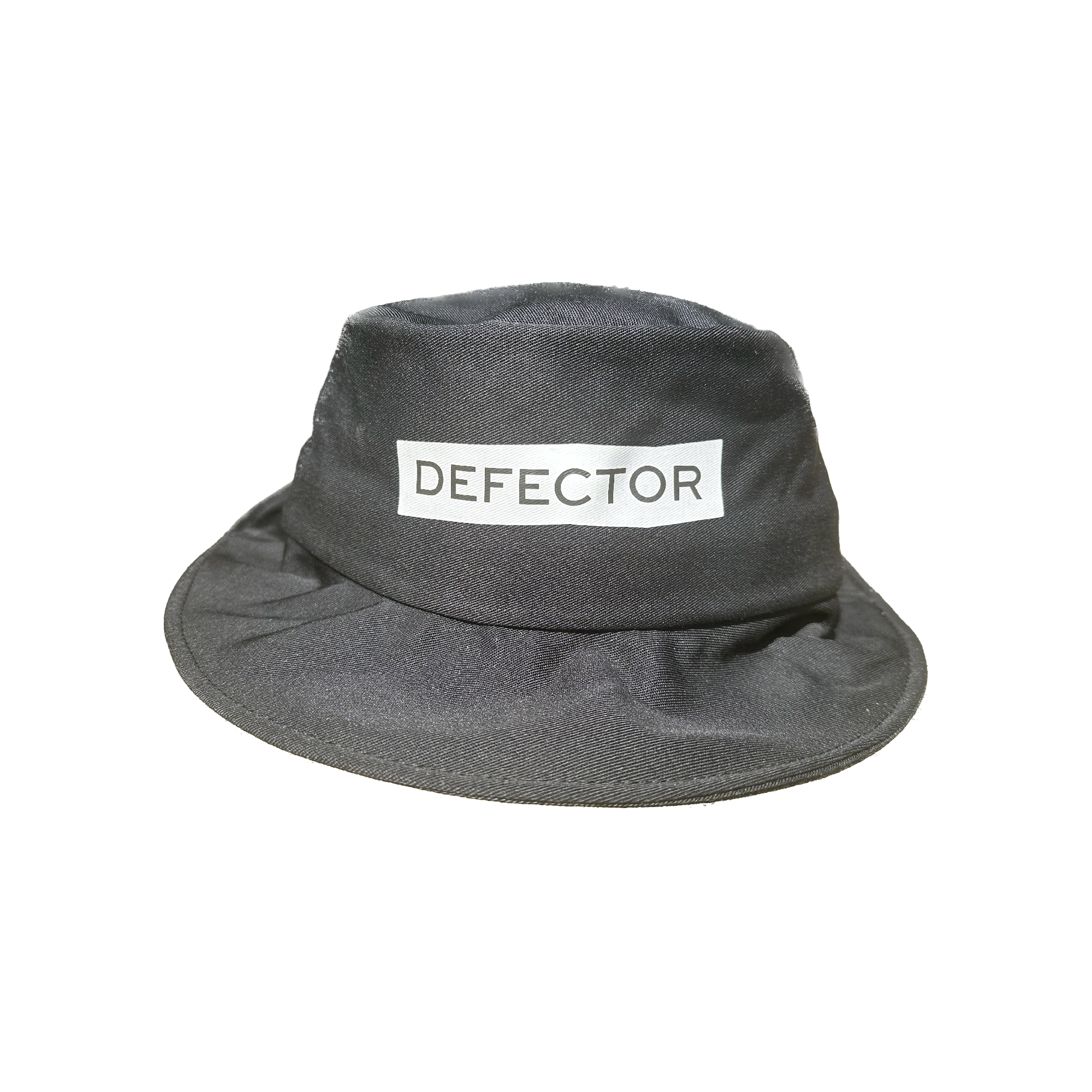 All black bucket hat with Defector logo in white on the center of it, printed.