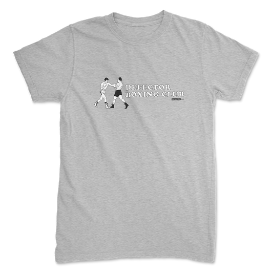 Defector shirt that says “DEFECTOR BOXING CLUB.” Features clip art of boxers.  Grey shirt in ‘unisex’ cut.
