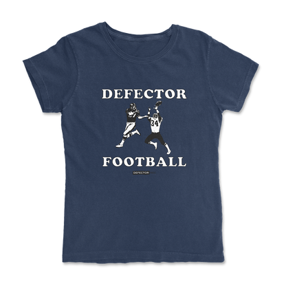 Defector shirt that says “DEFECTOR FOOTBALL.” Features clip art of American football players.  Navy shirt in ‘femme’ cut.