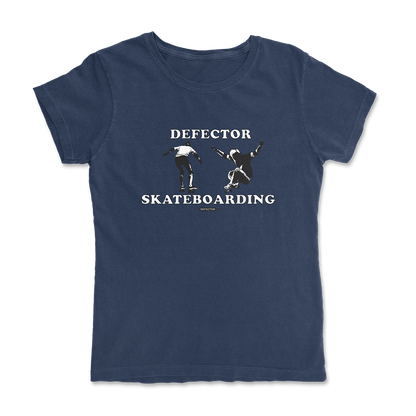 Defector shirt that says “DEFECTOR SKATEBOARDING.” Features clip art of skateboarding. Blue shirt in ‘femme’ cut.