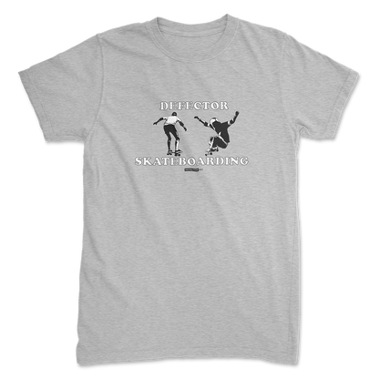 Defector shirt that says “DEFECTOR SKATEBOARDING.” Features clip art of skateboarding.  Grey shirt in ‘unisex’ cut.